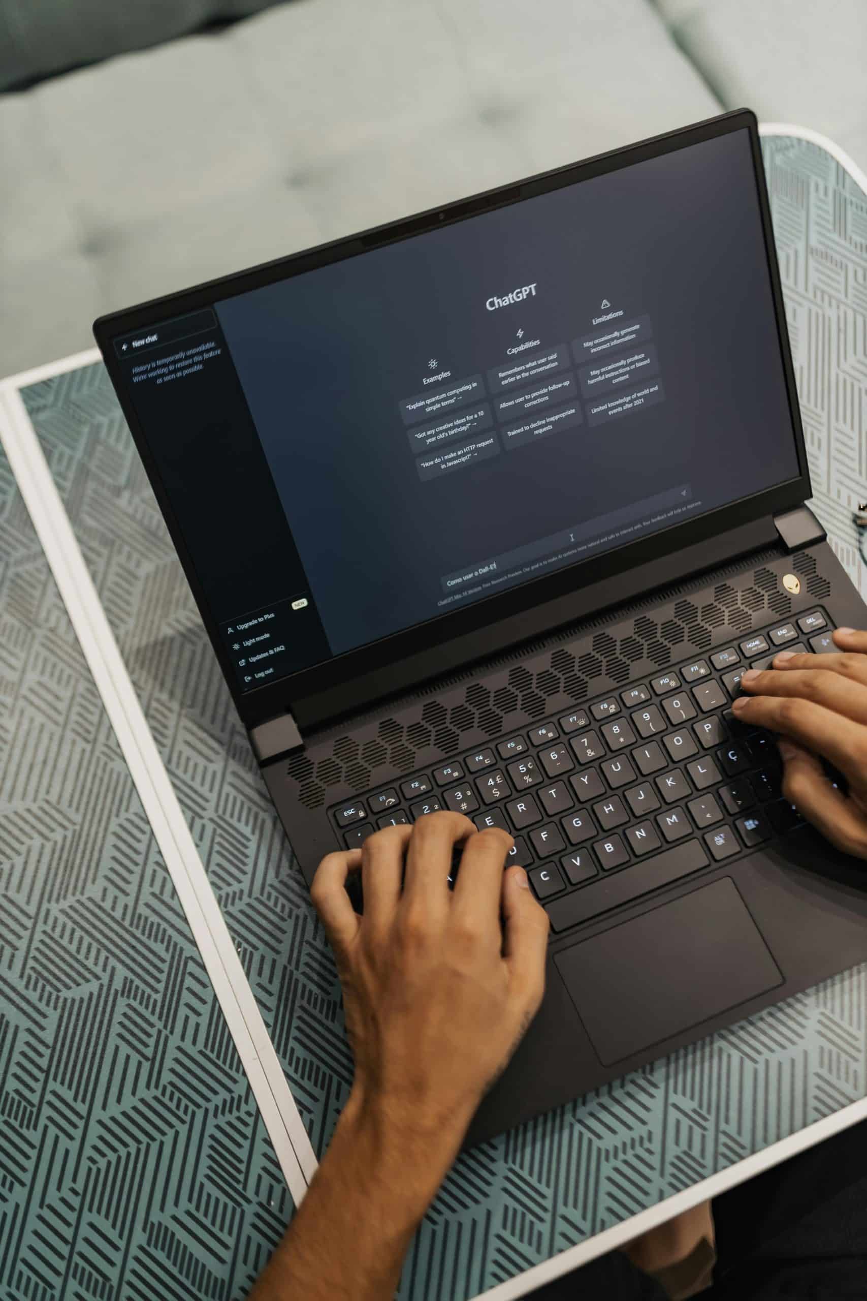 Laptop screen with AI / ChatGPT interface, user typing